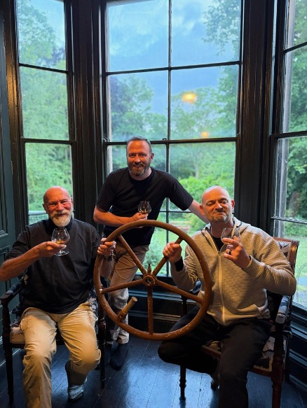 Celebrating a day of artifact identification with the U-534’s emergency steering wheel (l to r), Fred Engle, Ops Coordinator, BAREG; Dean Paton, Director, Western Approaches Museum; and Aaron Hamilton, Military Historian, Author, and Principal Investigator on BAREG’s U-1105 Survey.