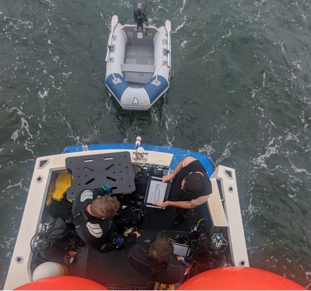 NAS instructor Troy N. provides final dive site brief to the BAREG students. Source: Chris P.