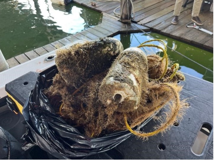 The recovered U-boat diver floats and line, and the line remnant recovered from the search periscope on 26 OCT. After 18 months tied into the U-boat tower the line chaffed through at the top of the bridge. Photos: Ops Coordinator