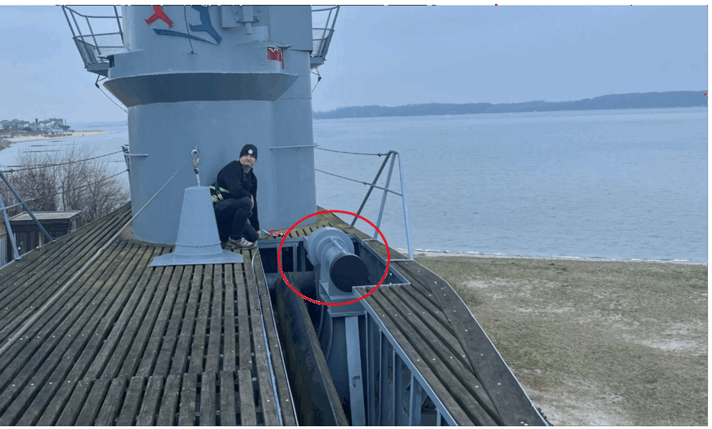 The U-995’s schnorkel mast actuator is circled in this photo taken during our visit to Laboe, Germany in April 2025. This component is missing from the U-1105. Note Aaron H. for scale. Photo: Ops Coordinator