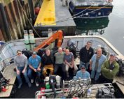 Nine BAREG divers aboard Huskyan after loading our gear upon arrival in Stromness.